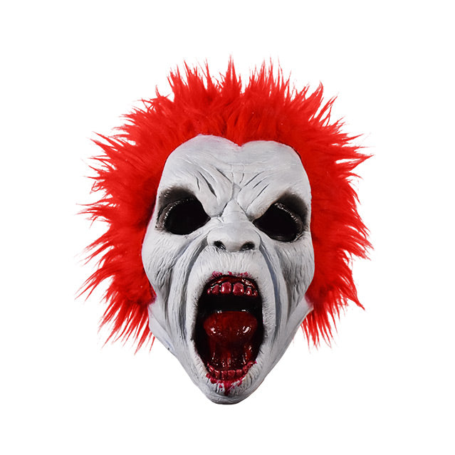 Mask, front view.  White wrinkled flesh, bright red spiked hair.  Empty black eye holes, wide open snarling mouth, bloody teeth and tongue, blood around lips.