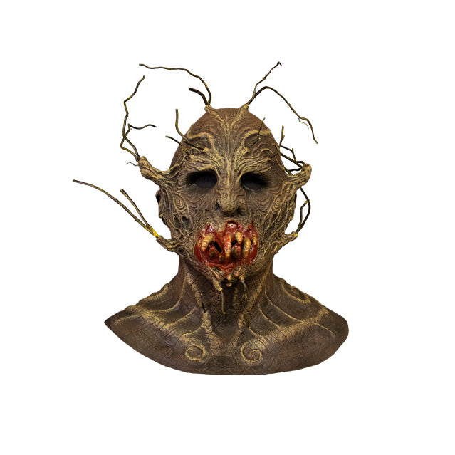 Mask, front view.  Head neck and collarbones.  Creature, brown woody bark-like flesh, twigs coming from top of head, eyebrows, upper cheekbones, jaw and chin. Gory mouth with yellow worm-like teeth.