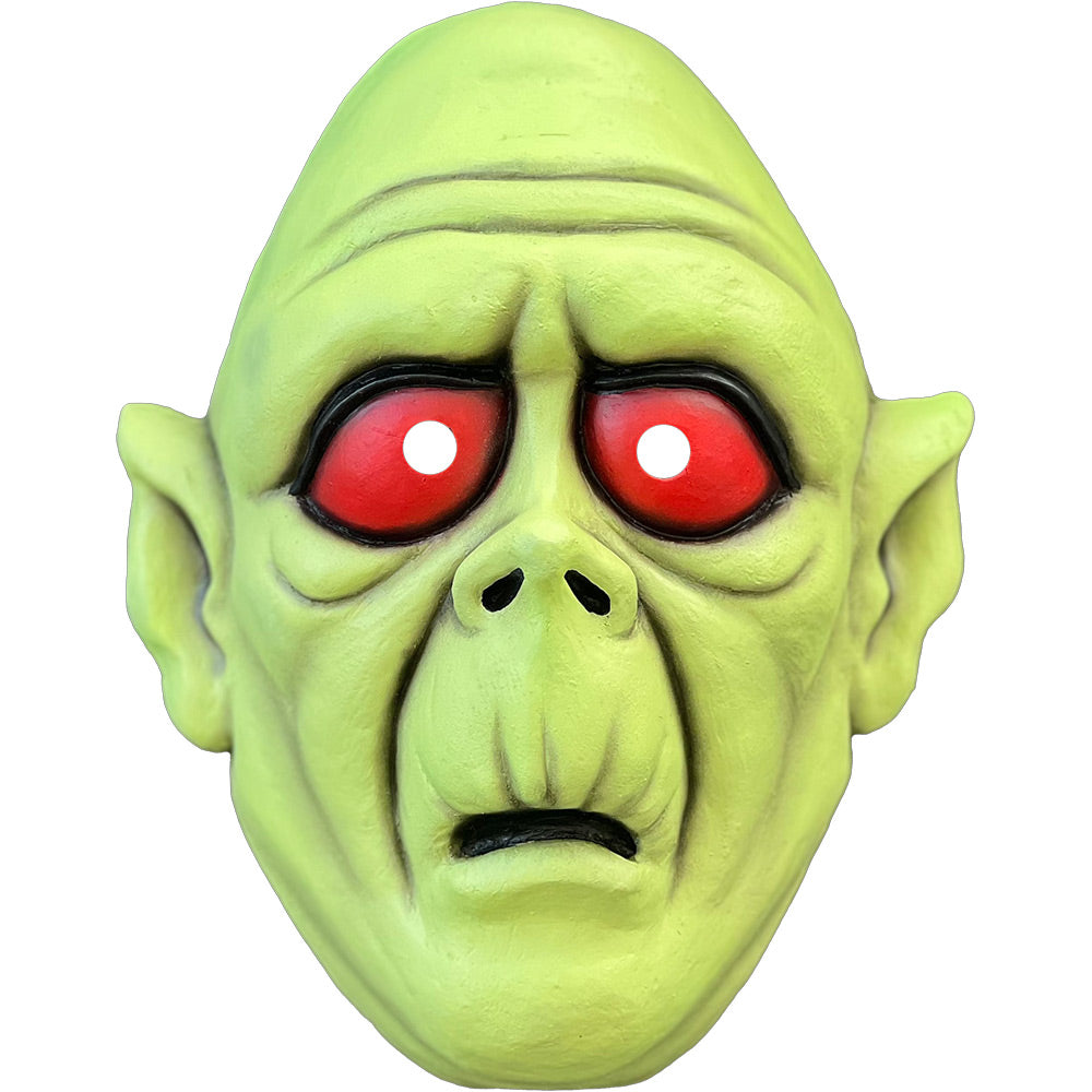 Mask, front view. Bald, green cartoon zombie face, black-rimmed, bulging, red eyes. Mouth slightly open.