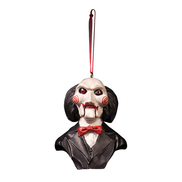 Ornament.  Bust, Saw Billy Puppet.  Head shoulders and upper chest.  Balding with black hair, white face, black-rimmed red eyes, red spirals on cheeks, red lips on hinged ventriloquist dummy mouth.  Wearing red bowtie, white collared shirt, black suit coat.