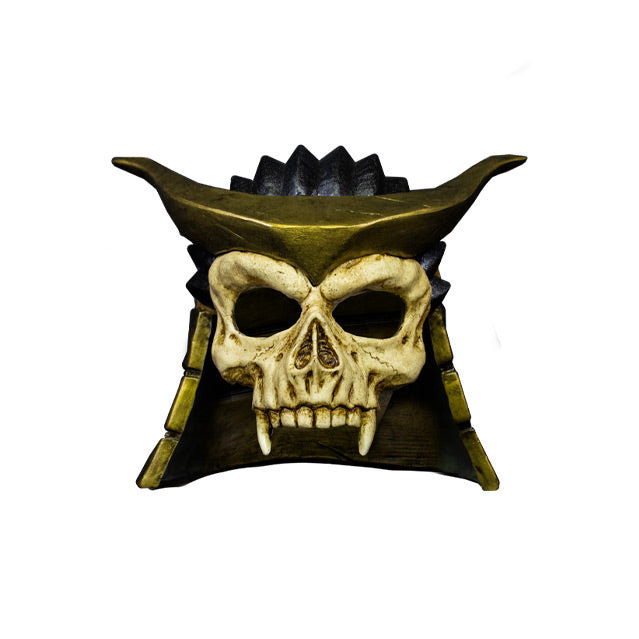 Plastic mask, front view.  Covers upper face and head.  Skull with fangs, no bottom jaw.  Wearing gold and black helmet.