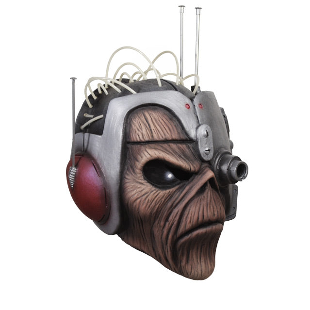 Mask, right side view. Eddie black right eye, silver space helmet with wires and antennae, covering head and left eye, red headset.,