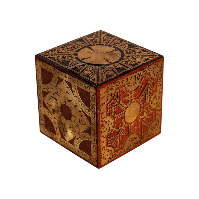 Cube with intricate designs, Black, gold and red.