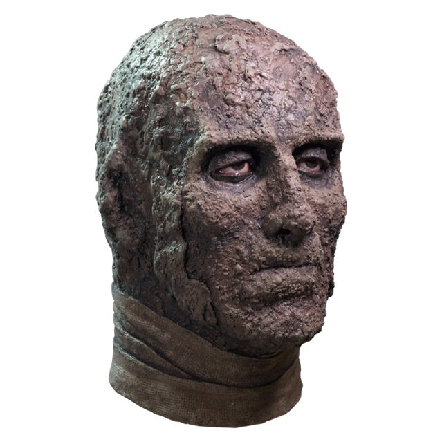 Mask, right side view, head and neck, Brown dried flesh, expressionless face, gray bandages around neck.