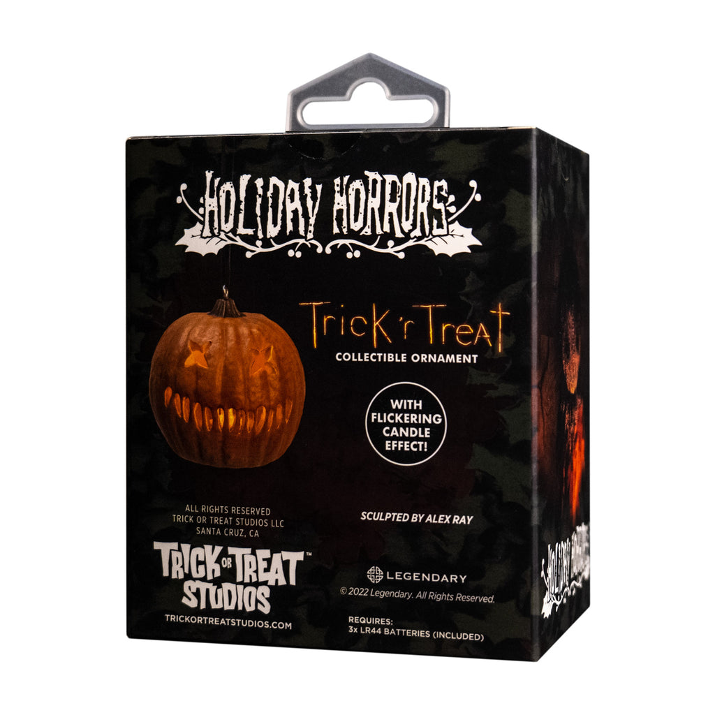 Product packaging, back.  Black  box showing ornament. Text reads Holiday Horrors, Trick r' Treat, collectible ornament, with flickering candle effect, Manufacturing and licensing information.