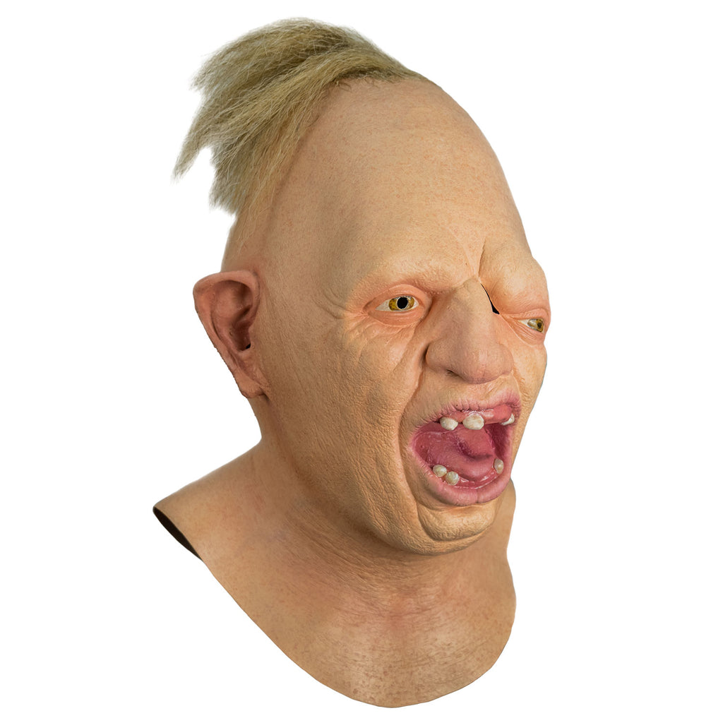 Mask, right side view, head, neck and upper chest. Egg shaped head, tuft of disheveled blond hair on top. No eyebrows, light brown eyes offset, left eye lower than the right. Large crooked nose. Deformed right ear. Mouth wide open showing pink tongue and gums and only 6 teeth.