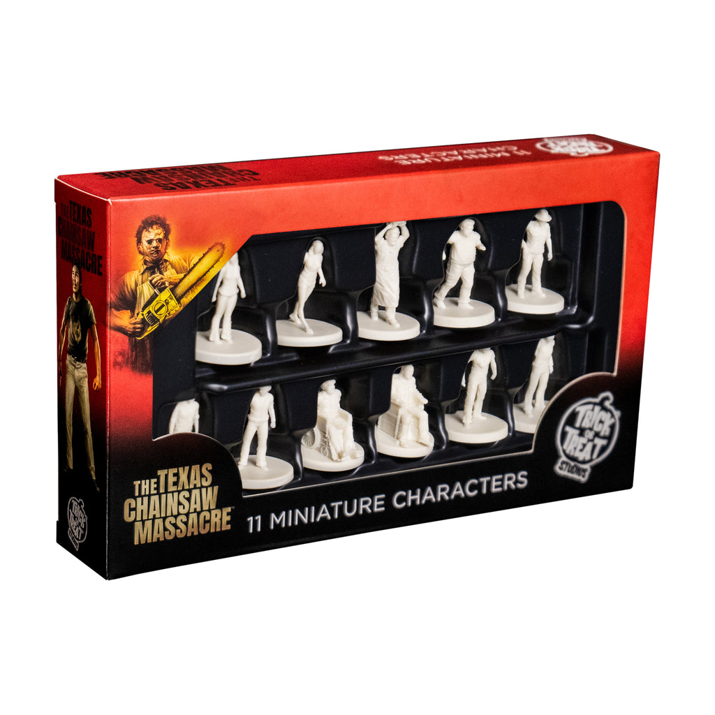 Texas Chainsaw Massacre miniatures in product packaging, front. White background.  Red and black box, illustration of Leatherface in top left corner. Window in box shows 11 white miniature figures. White text at bottom reads The Texas Chiansaw Massacre. 11 miniature characters. White Trick or Treat Studios logo bottom right.