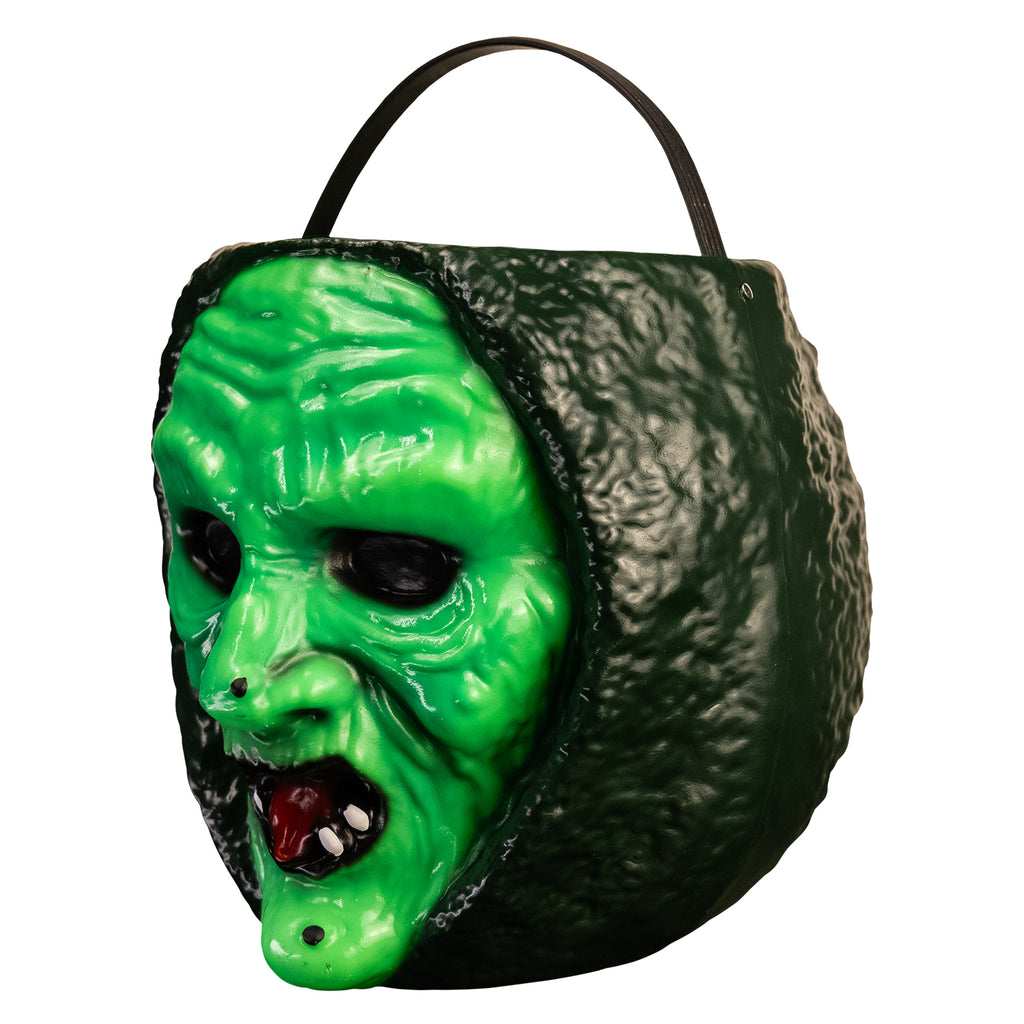 left view witch face candy pail. bright green face with warts, red mouth, dark green hood. Black handle at top.