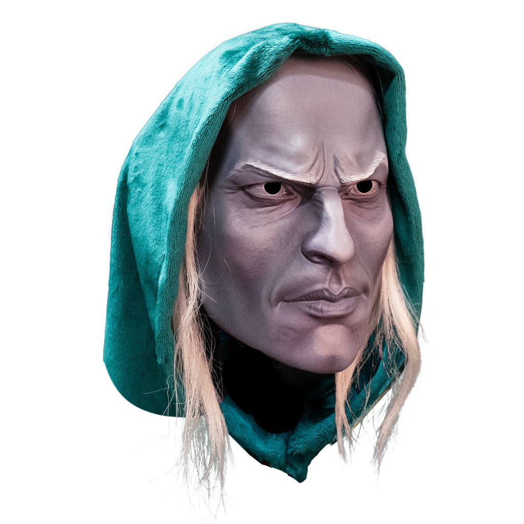 Plastic face mask, right view. Man's face, wearing green-blue hood, long light blond hair, pale skin, furrowed brow, strong nose, cheeks and jaw, mouth close.
