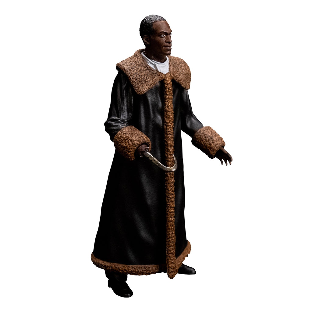 Candyman figure right side view. Man short brown hair, brown skin. wearing a white shirt under a full-length black leather coat with tan fur-trimmed large collar and cuffs. black boots and a hook for his right hand.