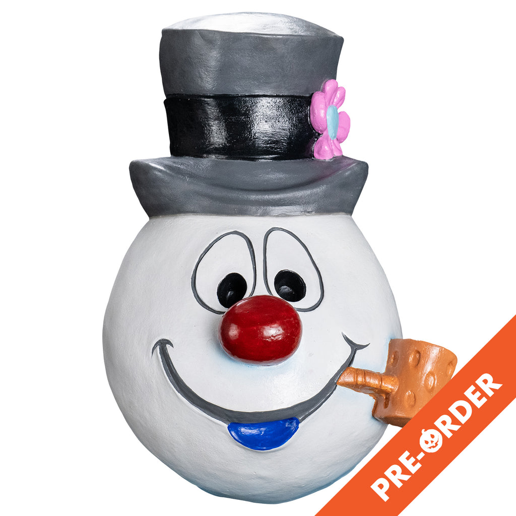 white background, orange diagonal banner bottom right, white text reads pre-order.  Mask, front view. Cartoonish, white round snowman head, wearing a gray top hat with a black band and a pink flower on the left side. Face has large cartoon eyes, round red nose, gray cartoon mouth with blue bottom lip, tan pipe in the left corner of mouth.