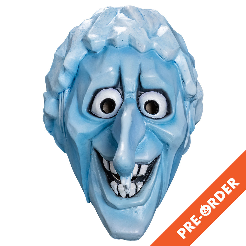 white background, orange diagonal banner bottom right, white text reads pre-order.  Mask, front view. Cartoonish head, pale blue angular ice-like hair, skin is light blue, furrowed brow, no eyebrows, large cartoon eyes, very long prominent nose with icicles hanging from the tip, angular forehead, cheeks and chin. open, smiling mouth showing large square white teeth.