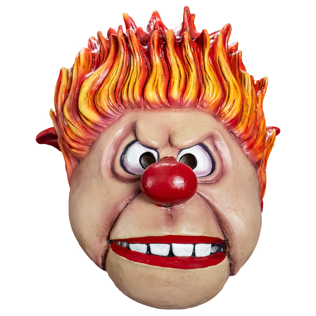 Mask, front view. Cartoonish, round head,  Yellow orange and red flame-like spiky hair, pointy red-tipped ears,  furrowed brow, no eyebrows, large cartoon eyes, round red nose, prominent jowls, wide red-lipped mouth, slightly open showing large square white teeth.