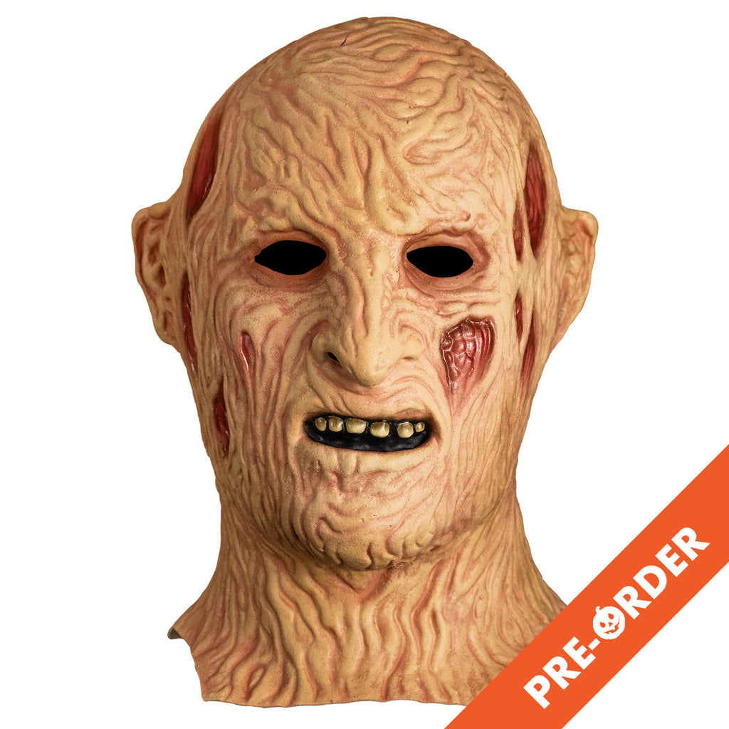 white background, orange diagonal banner bottom right, white text reads pre-order.  Freddy Krueger mask front view. head and neck, burnt skin, wrinkled with sores and scars. mouth slightly open showing dirty brown upper teeth.