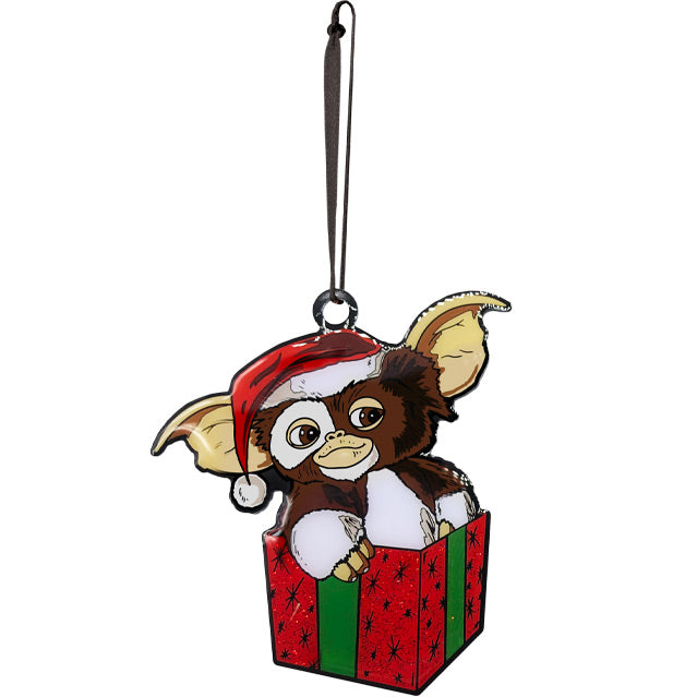 Gremlins Gizmo metal ornament. Brown and White Gizmo, wearing Santa hat, sitting in red and green gift box,