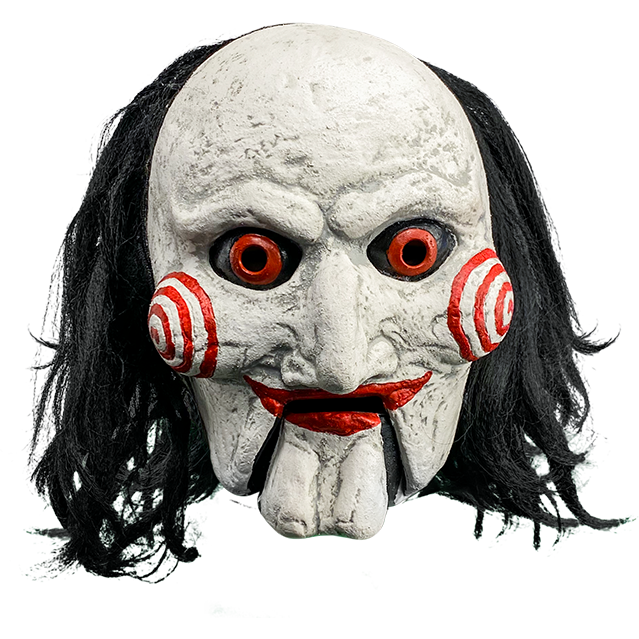 Mask, front view.  Saw Billy puppet, balding with black hair, white face, black-rimmed red eyes, red spirals on cheeks, red lips on hinged ventriloquist dummy mouth.