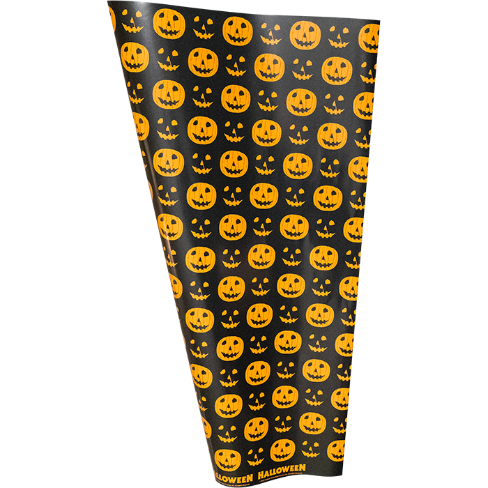 Wrapping paper.  black background printed with alternating orange jack o' lanterns and orange jack o' lantern faces.