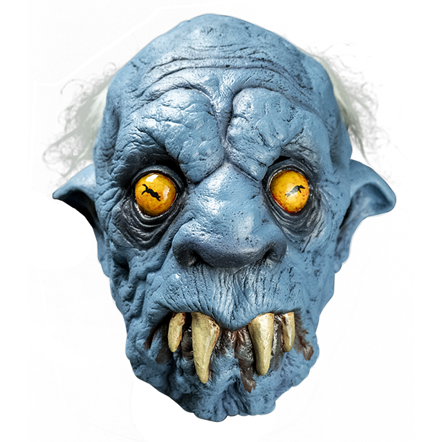 Mask, front view.  Creature, mostly bald, wispy white hair on back of head. Wrinkled blue skin.  Yellow eyes, pointed ears, large nose. Downturned mouth with 4 large fangs protruding, brown drool.