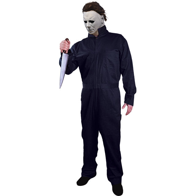 Person in Michael Myers mask and blue coveralls, holding a butcher knife.