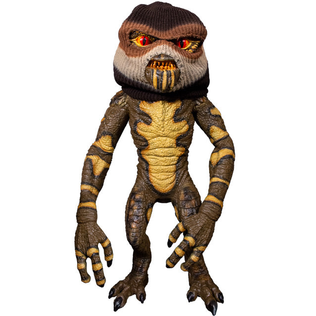 Gremlin Puppet, full view.  Orange eyes, sharp teeth, black claws on hands and feet.  Wearing brown, white and black ski mask.