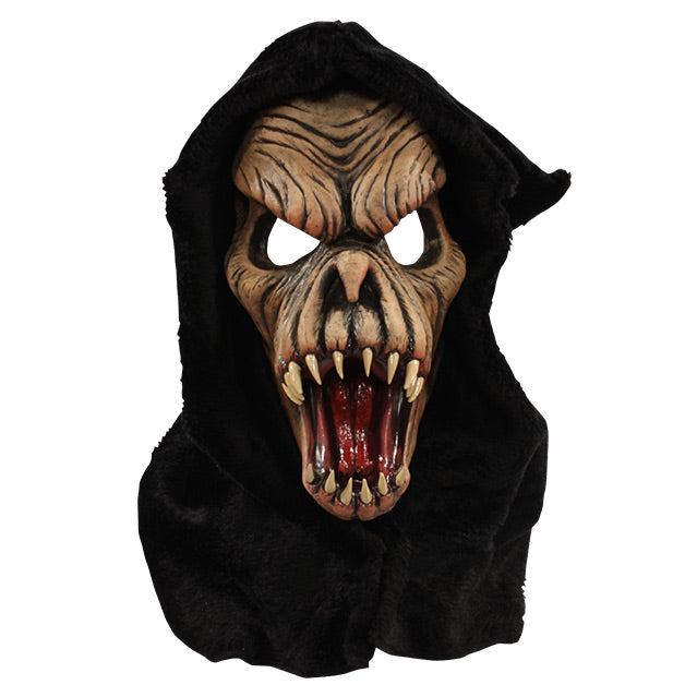 Front view. Brown faced creature in black hood, wrinkled skin, wide open mouth showing tongue and several large fangs.