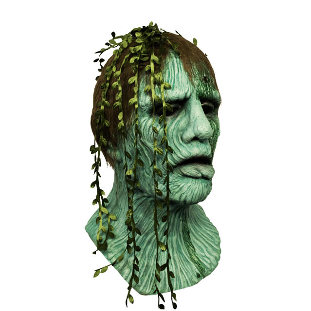 right side view, Creepshow Harry Mask. Head and neck of man. Red brown straight hair, with seaweed in it, green wrinkled mossy skin, eyes appear closed. hole in forehead oozing dried green fluid.