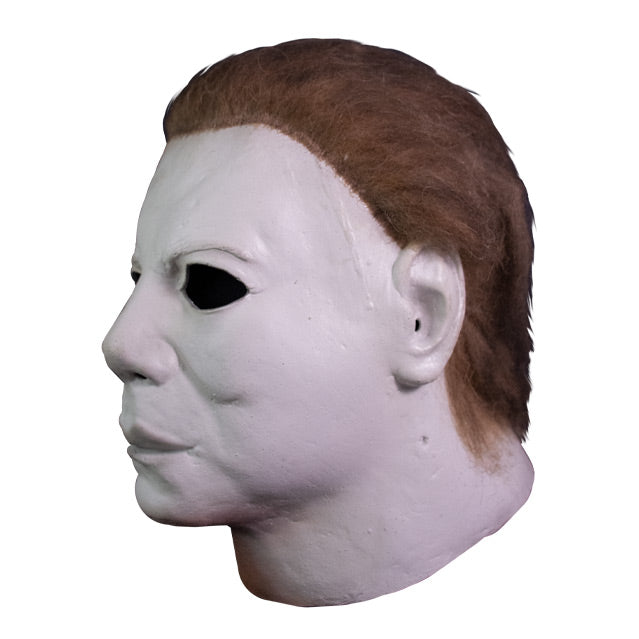 Left side view, mask, head and neck. White skin, dark brown hair.