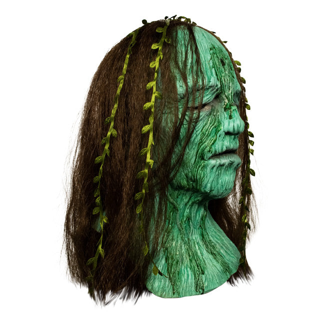 Right side view, Creepshow Becky Mask. Head and neck of woman. Red brown straight hair, with seaweed in it, green wrinkled mossy skin, eyes appear closed. hole in forehead.
