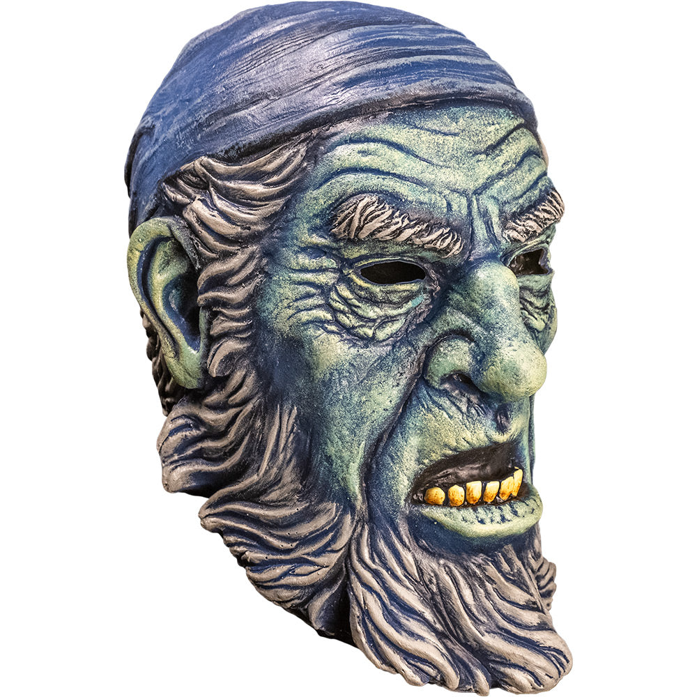 Mask right side view. Old man face, blue wrinkled skin, Blue bandana on head. Gray hair, eyebrows, sideburns and beard. Mouth open showing yellowed bottom teeth.