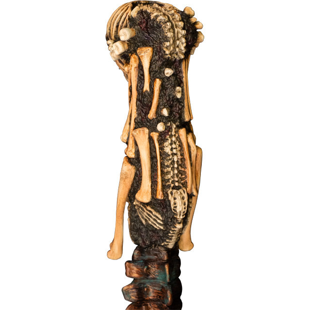 Kandarian dagger prop. Handle has skull at top, knife includes teeth, spinal cord, and rib bones