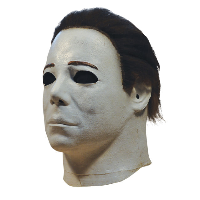Left side view, mask, head and neck. White skin, dark brown hair.
