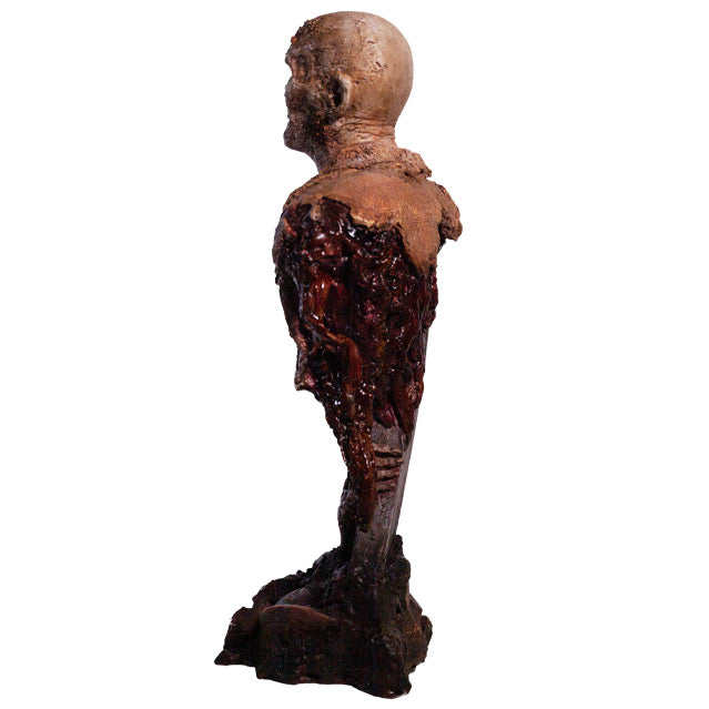 Bust, back side view. Rotted zombie head neck and upper torso, wearing dirty rotted torn clothing. Gore around shoulders, bottom of torso and back. Base is gravestone set in soil, with zombie arm coming from the ground.