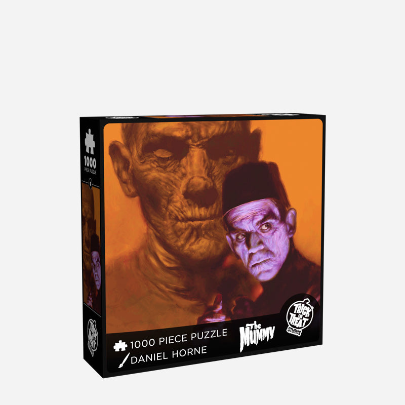 Mummy Identities jigsaw puzzle box cover.  Showing mummy in orange background, man wearing fez in foreground. Text reads 1000 piece puzzle, Daniel Horne, The mummy.  White Trick or Treat Studios logo.