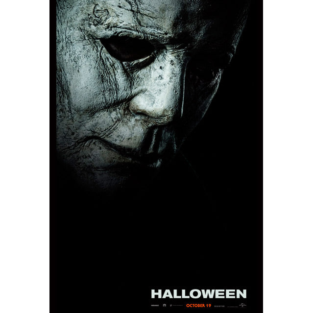 Movie poster Halloween 2018, close up of Michael Myers mask, weathered white skin, black background. White text at bottom reads Halloween, orange text reads October 19.