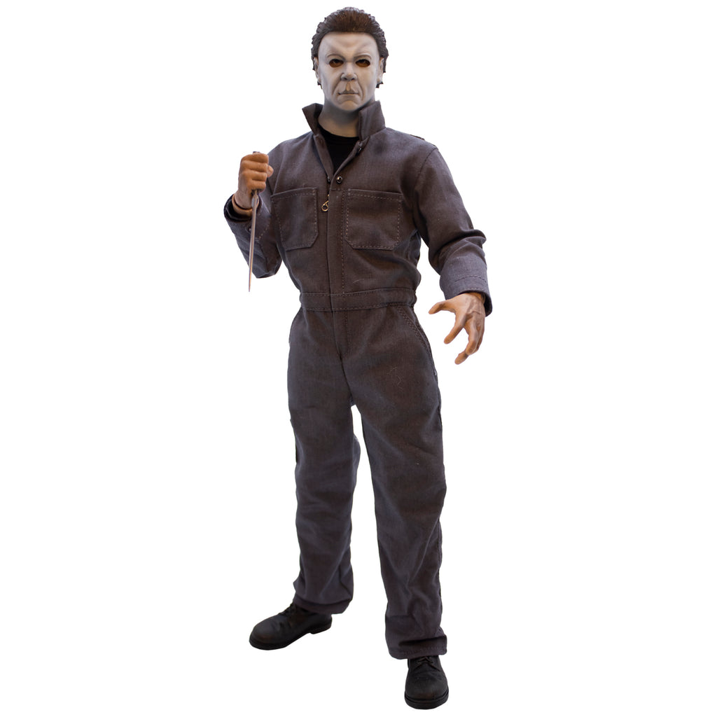 Front view, Michael Myers 12 inch action figure. Wearing Halloween Resurrection mask, coveralls, black boots. holding knife in right hand.