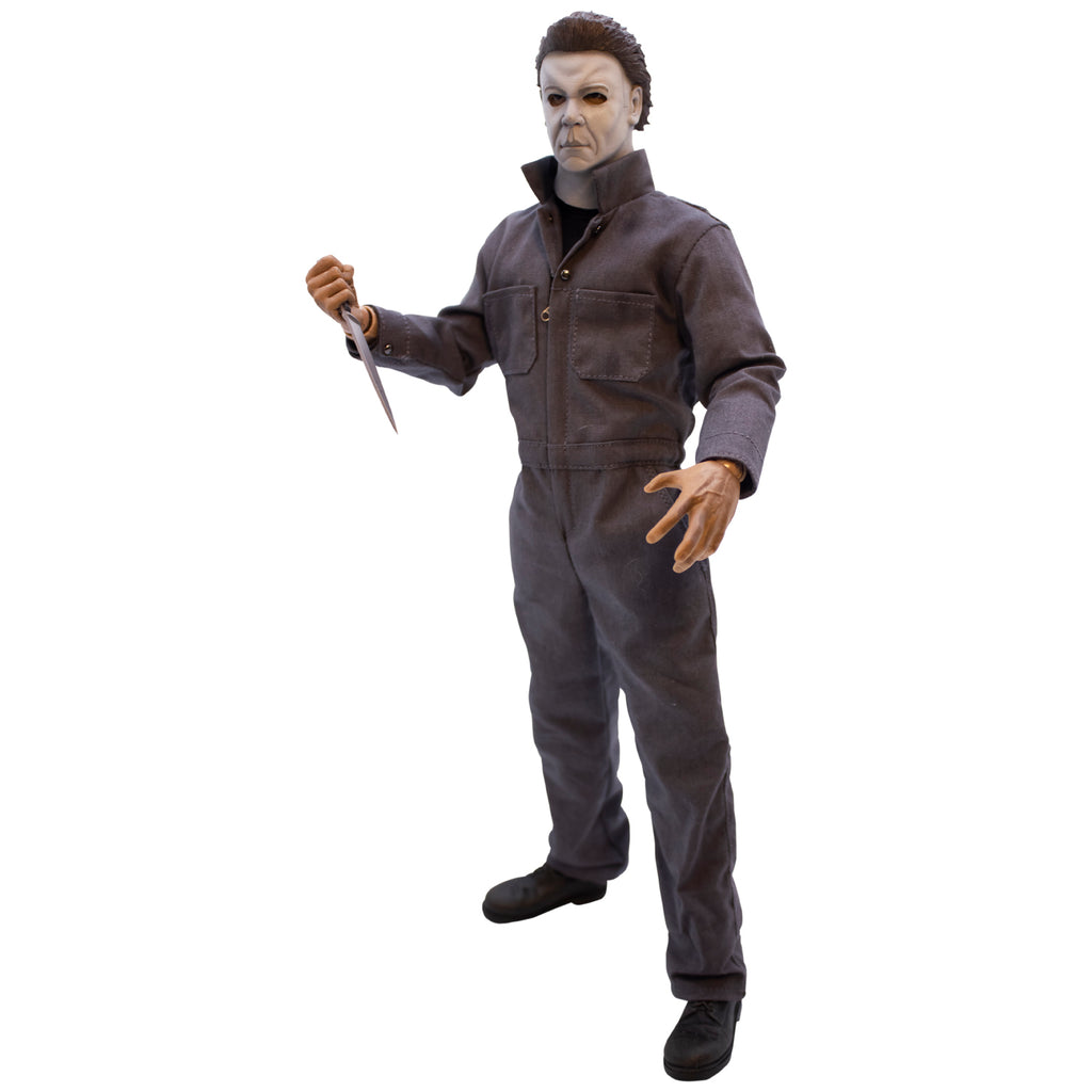 Left side view, Michael Myers 12 inch action figure. Wearing Halloween Resurrection mask, coveralls, black boots. holding knife in right hand.