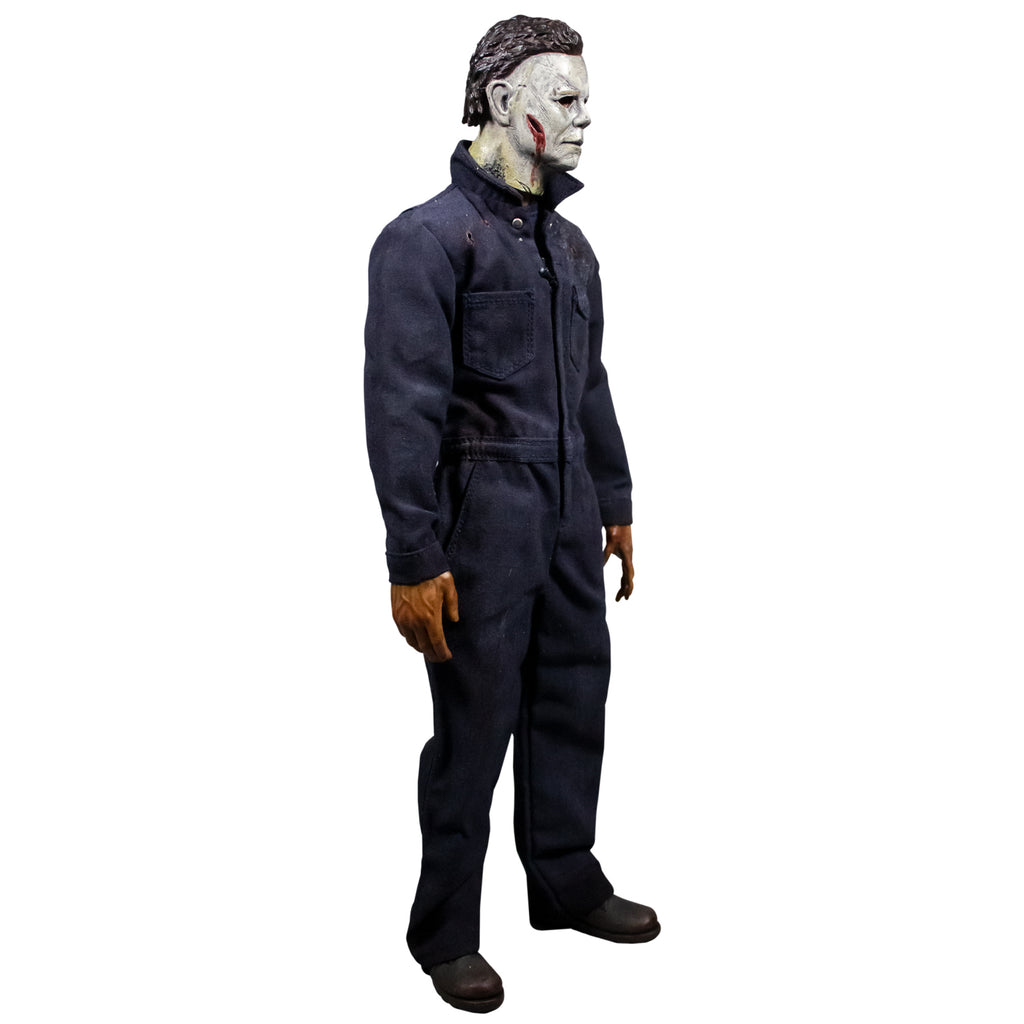 Right side view, Michael Myers 12 inch action figure. Wearing Halloween kills mask, wound on right cheek, blue coveralls, black boots.
