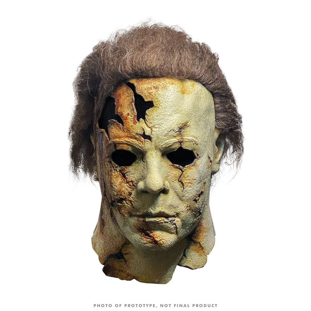 Mask, head and neck.  Brown hair, distressed and cracked pale skin.