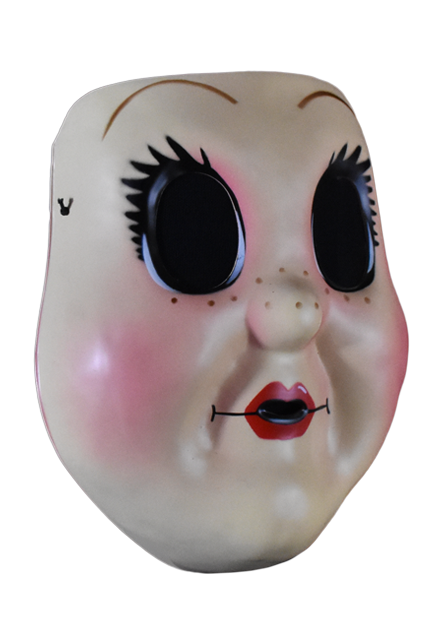 Plastic face mask, right view. Dollface, large empty black eyes with spiky eyelashes. Thin brown eyebrows. Freckles on nose and cheeks, smiling mouth with small red lips. Plump pink cheeks.