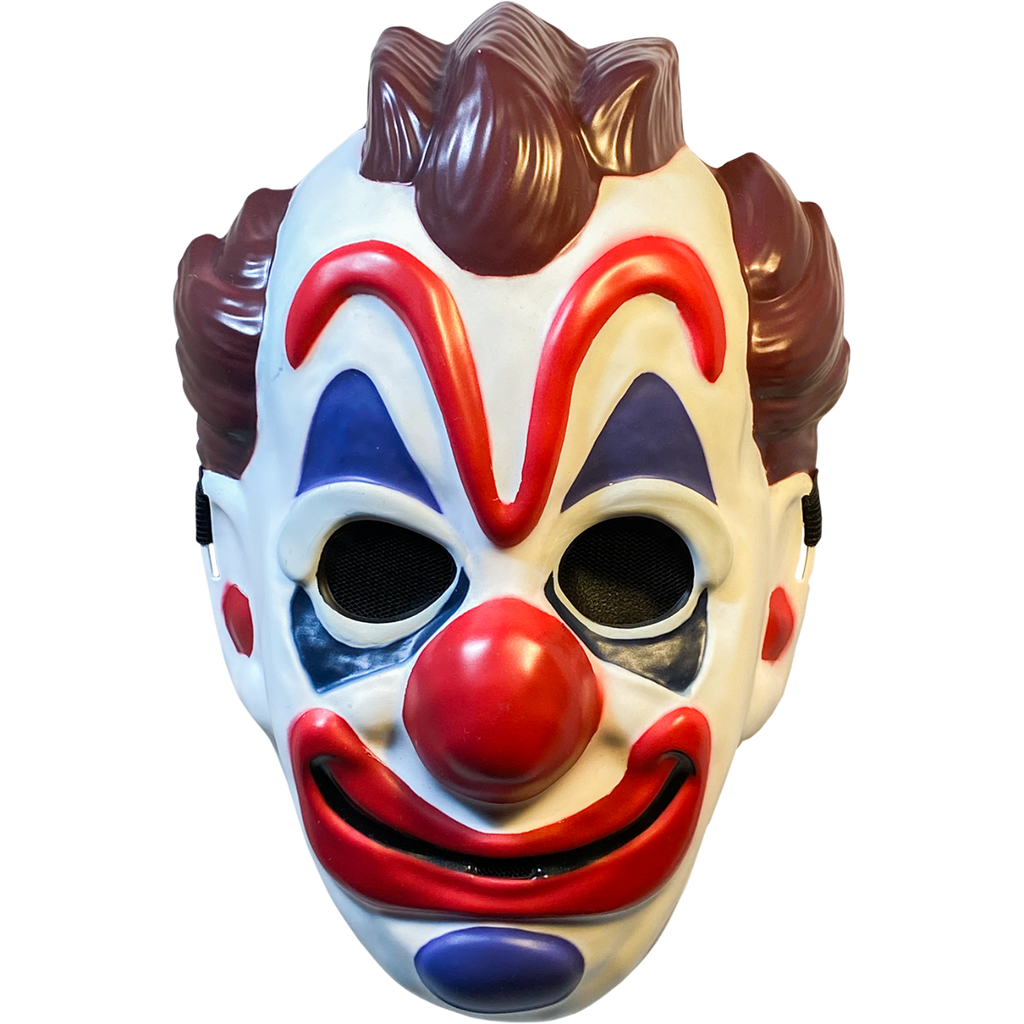 Plastic mask, front view.  White clown face, brown hair on top and sides of head.  Exaggerated red eyebrows, nose, and smiling mouth.  Blue above and below eyes and on chin