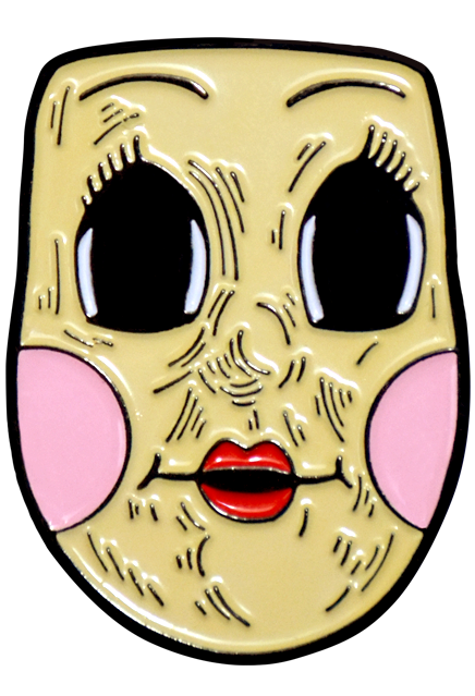 Enamel pin. Illustration of dollface mask. Large empty black eyes with spiky eyelashes. Thin brown eyebrows. Freckles on nose and cheeks, smiling mouth with small red lips. Pale pink circles on cheeks