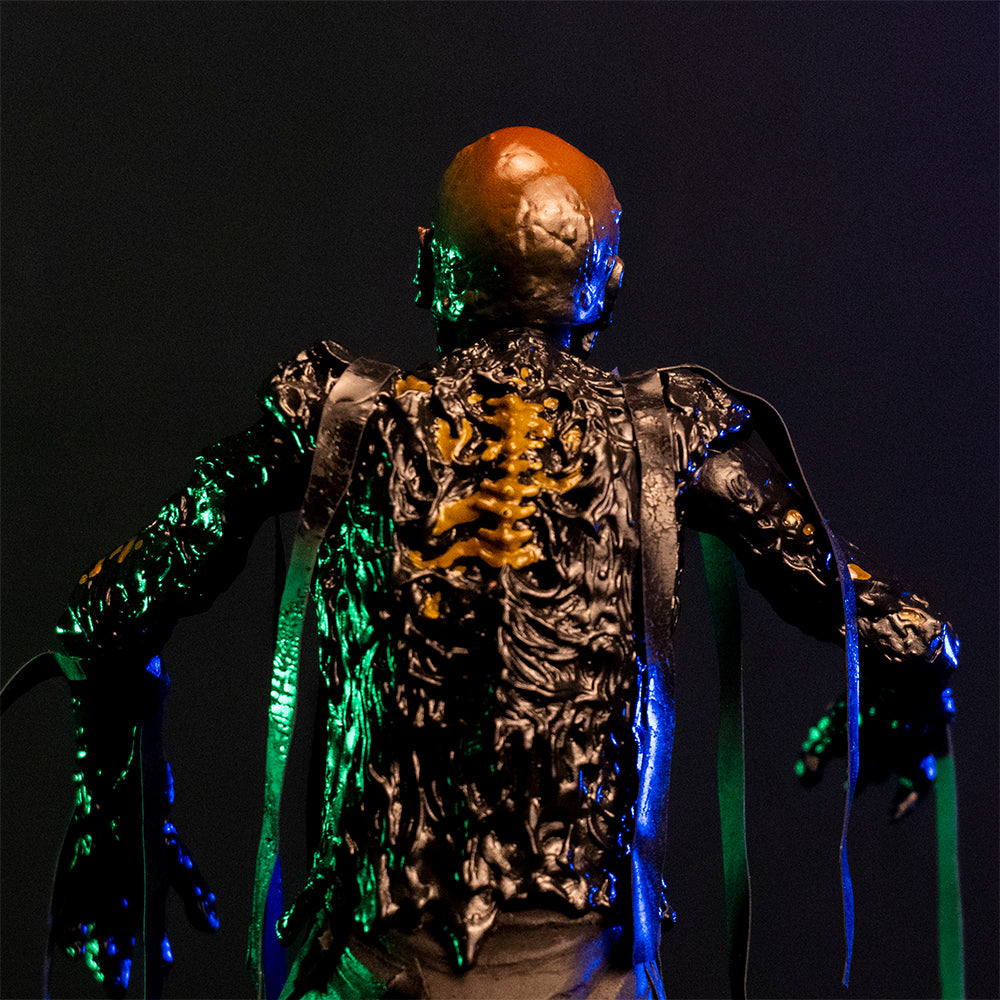 1/6 scale Tarman figure, back view, closeup above waist.  Bare skull, tar covered body, ribs showing through dripping tar.