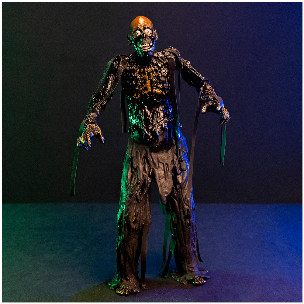 1/6 scale Tarman figure, front view.  Bare skull, grinning mouth, tar covered body, ribs showing through dripping tar.
