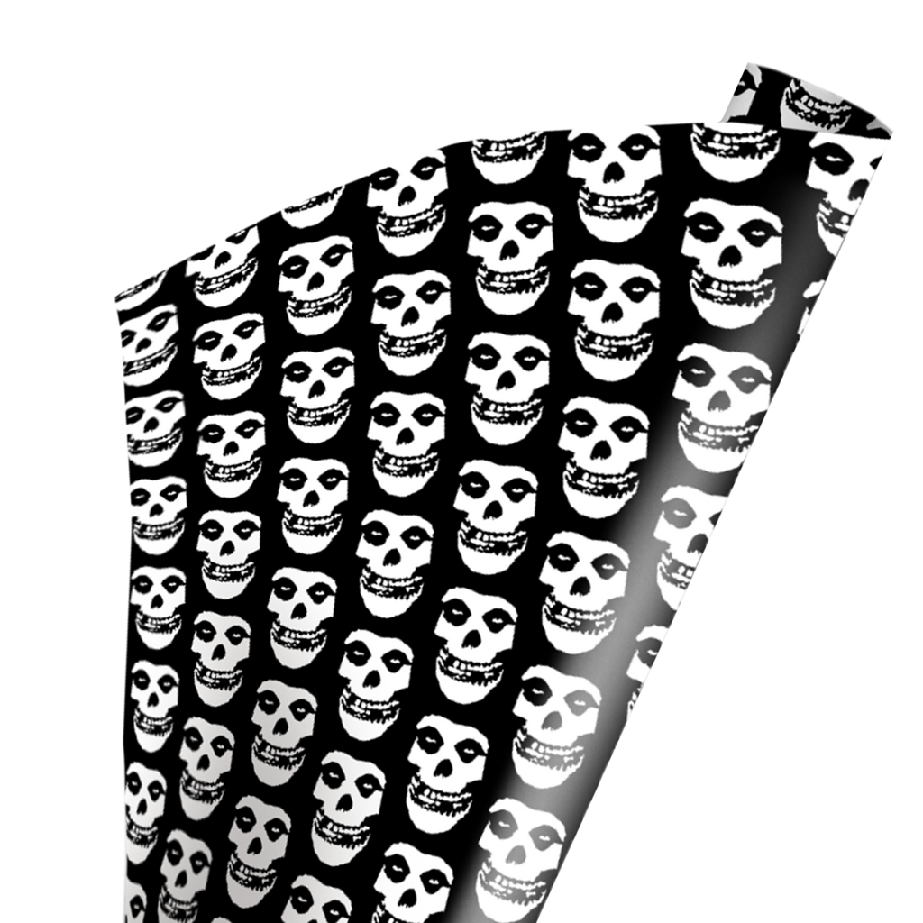 Wrapping paper.  Black and white, repeating pattern of Misfits Fiend skull face. 