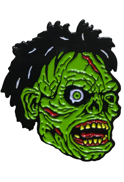 Enamel pin. Black bushy hair, Green flesh, wrinkled and wounded. Bulging, bloodshot right eye, missing left eye and nose. Open snarling mouth with yellow crooked teeth.