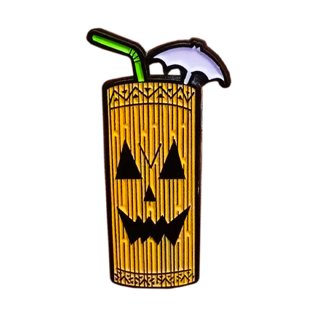 Enamel pin.  Cocktail Tiki mug, green straw, white drink umbrella. Brown wood look with jack o' lantern tiki face.