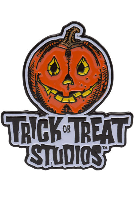 Enamel Pin. Orange yellow and black Jack o' lantern with smiling mouth, above black text that reads Trick or Treat Studios. on a white background.