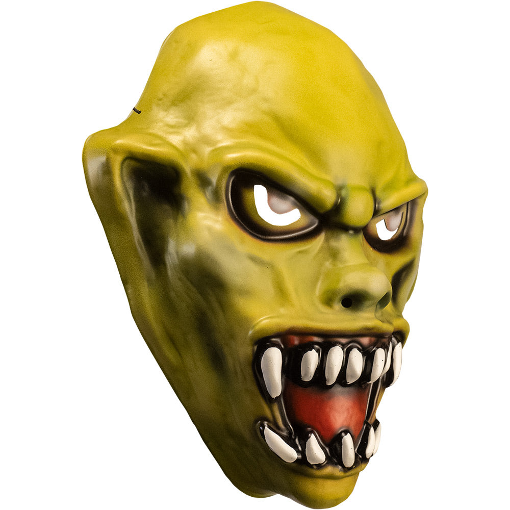 Vacuform plastic mask, right side view. Yellow skin. Angry face with large ears, yellow eyes, large snarling mouth with sharp white teeth.