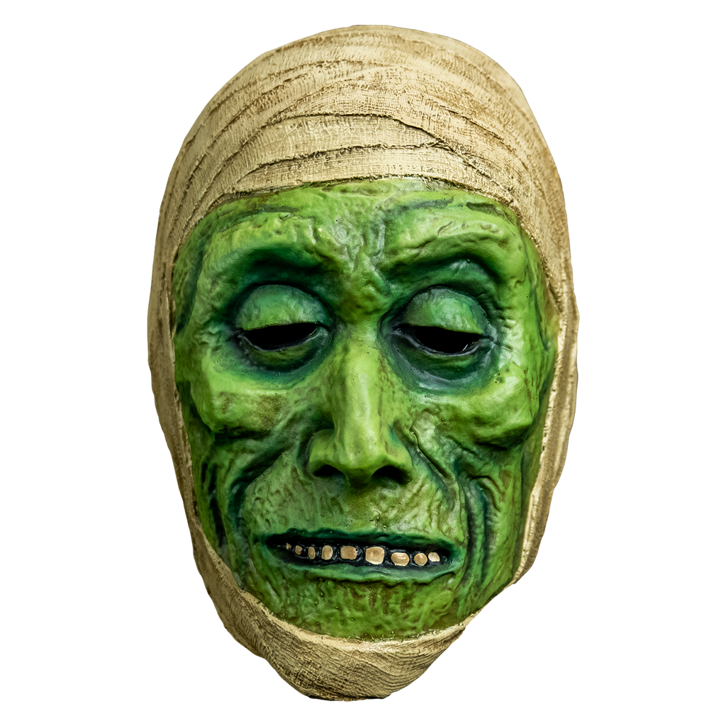 mask, front view.  green distressed flesh, eyes slightly closed, mouth with thin lips open showing row of teeth.  wrapped in off-white bandages around top of head and perimeter of face.
