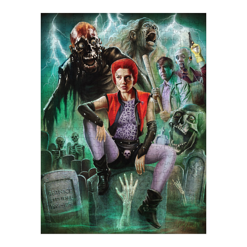 completed puzzle. Illustration, red, green, black and white scene. Red haired woman sitting on a gravestone in the foreground, hand reaching out of a grave in front of her, skeletons, zombies and movie characters in the background